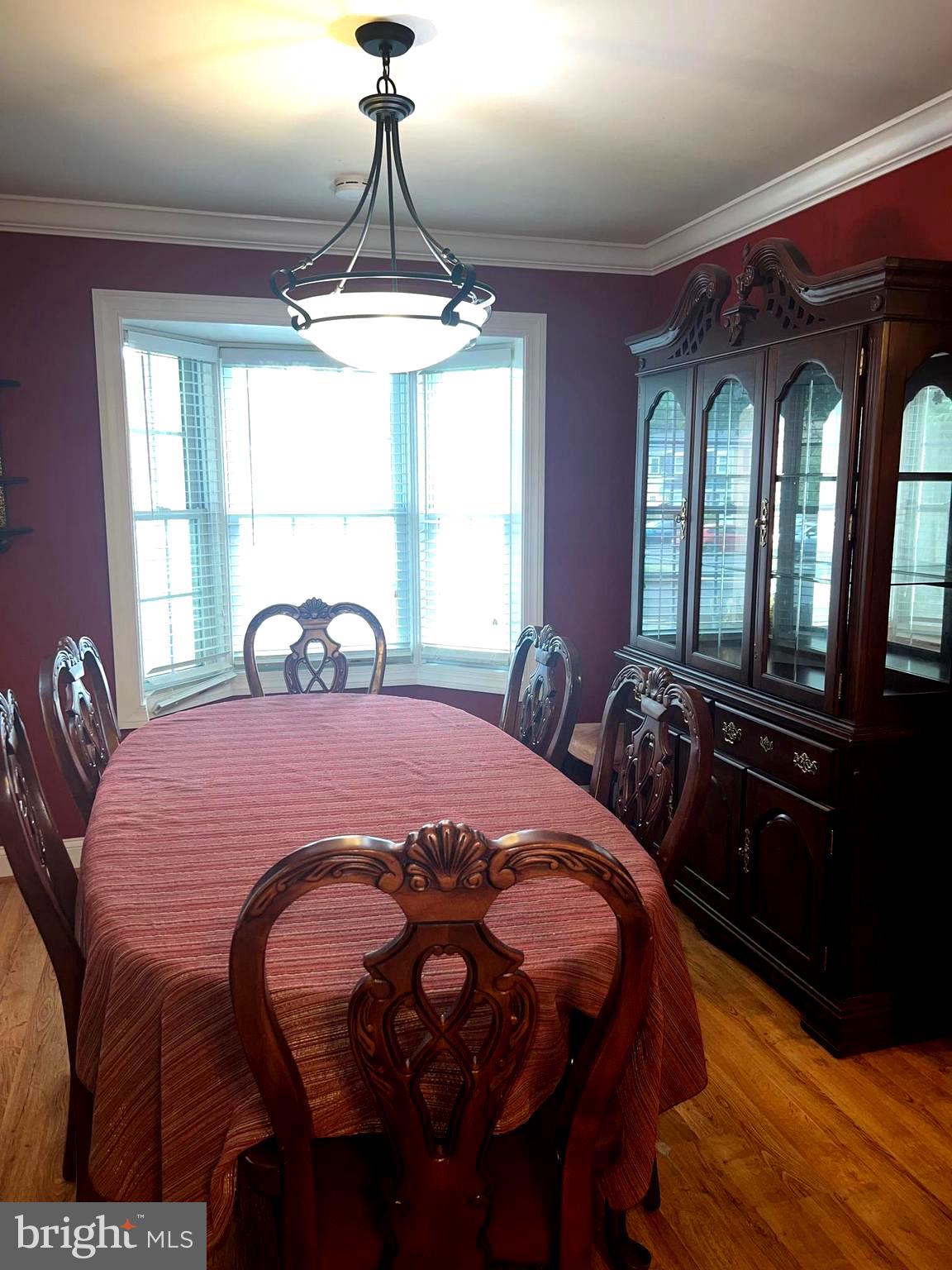 1761 Aberdeen Circle Crofton, MD 21114 - Photo 33 of 33 a bedroom with a bed and a chandelier