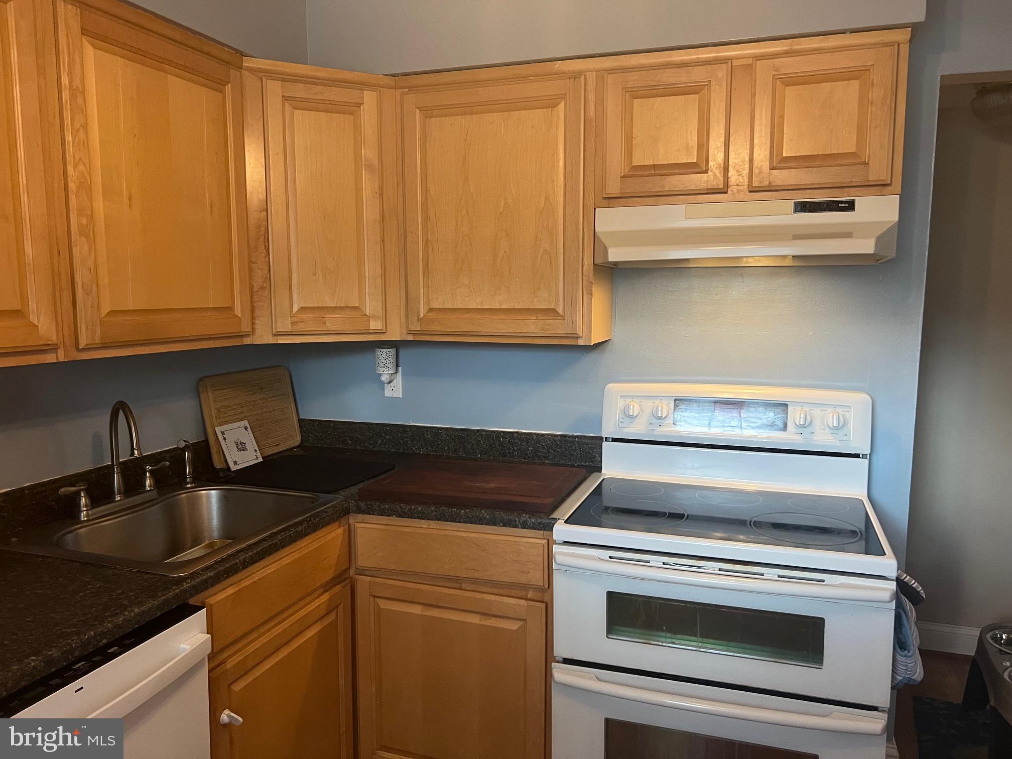 1761 Aberdeen Circle Crofton, MD 21114 - Photo 5 of 33 a kitchen with granite countertop cabinets stainless steel appliances and a sink