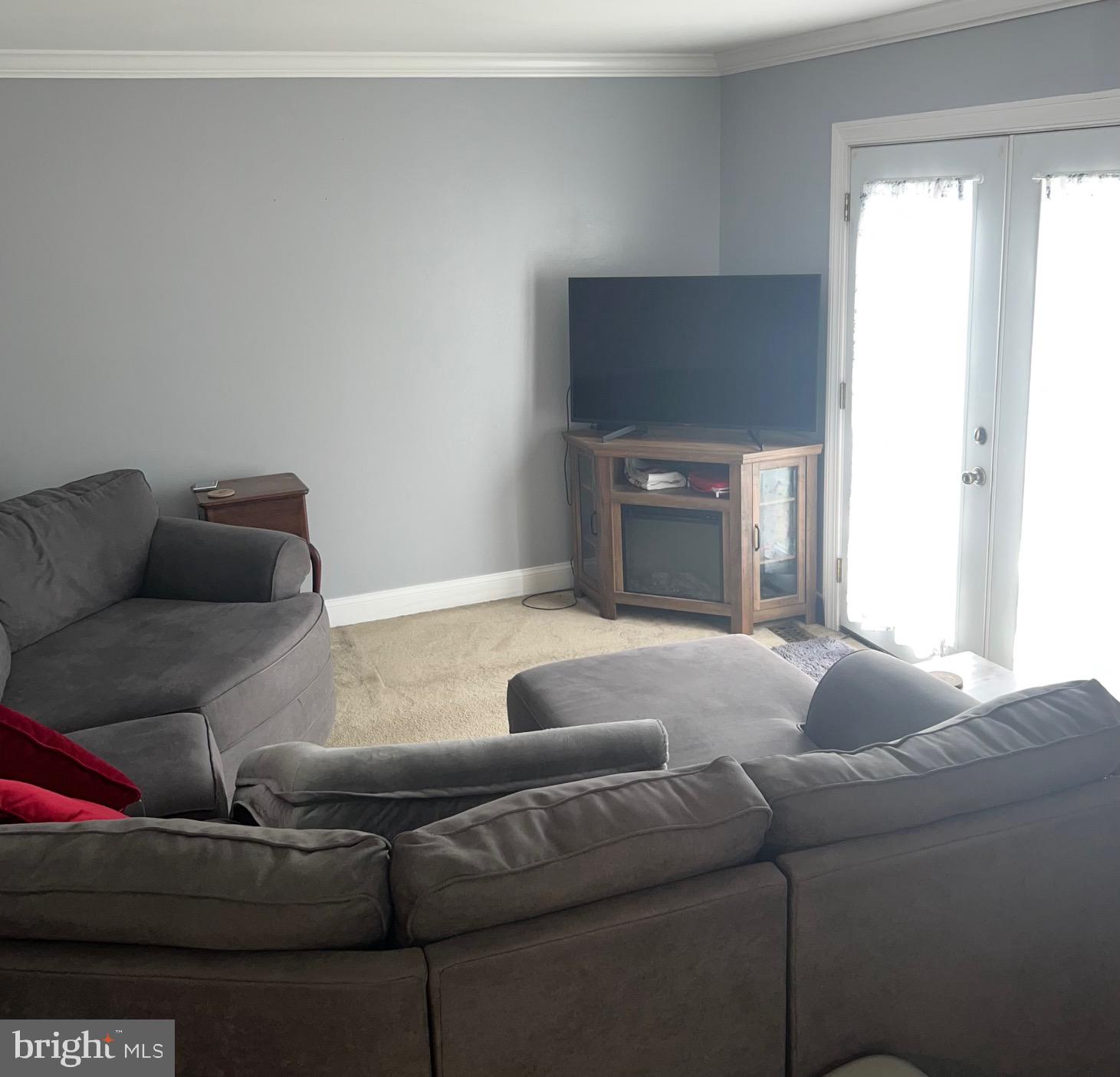 1761 Aberdeen Circle Crofton, MD 21114 - Photo 9 of 33 a living room with furniture and a window