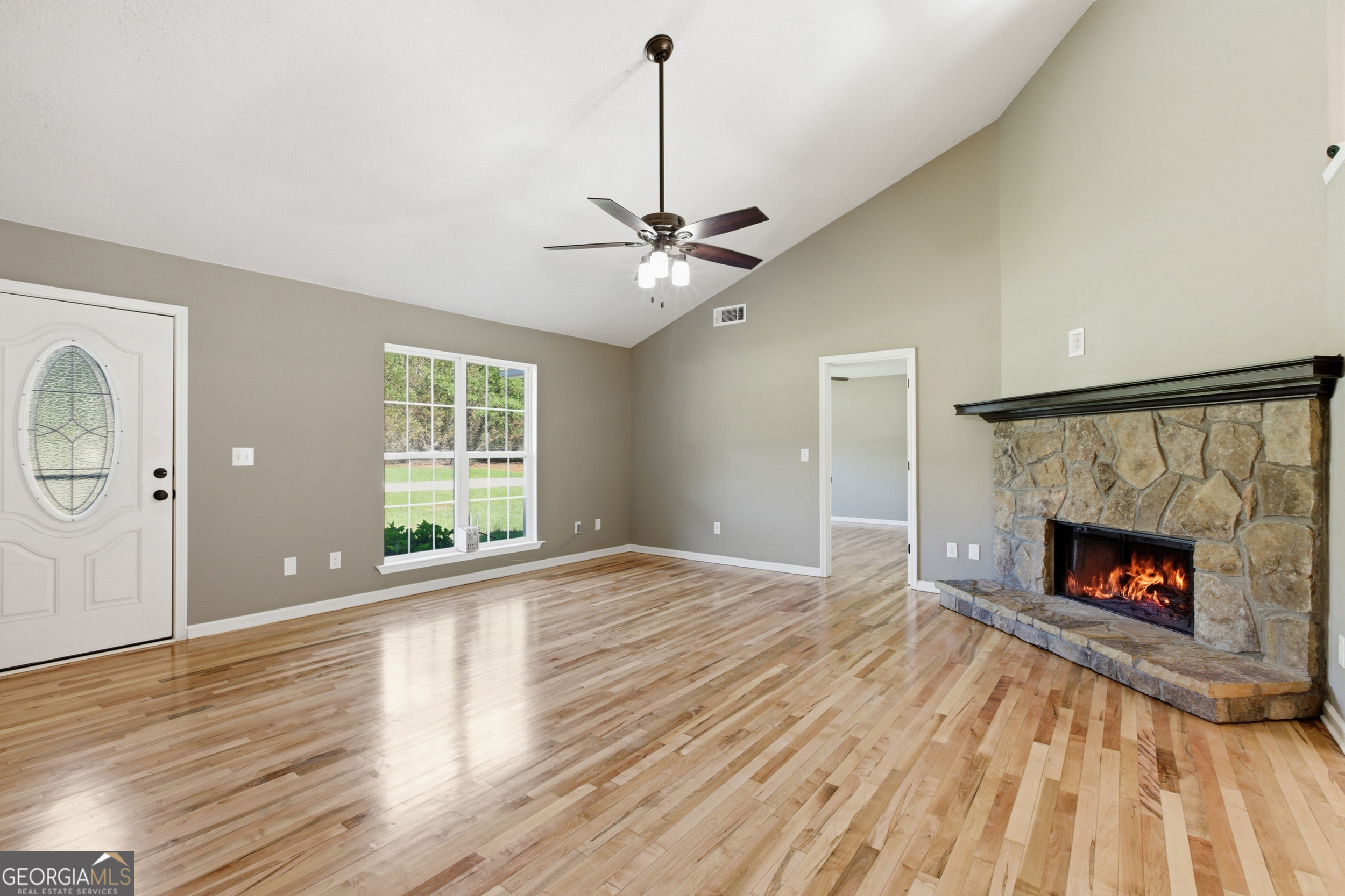 171 Winding Way Hartwell, GA 30643 - Photo 9 of 37 a view of empty room with fireplace and wooden floor