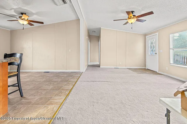 a view of livingroom with hardwood floor and a ceiling fan