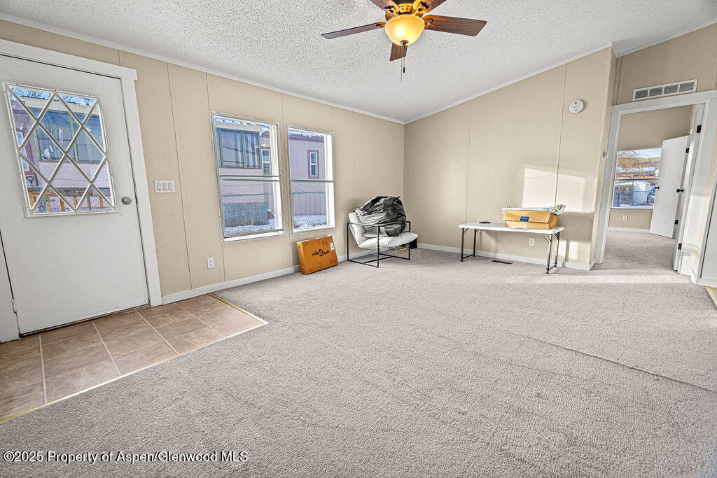 405 Hawthorn Street Craig, CO 81625 - Photo 15 of 35 a view of a livingroom with furniture and a ceiling fan