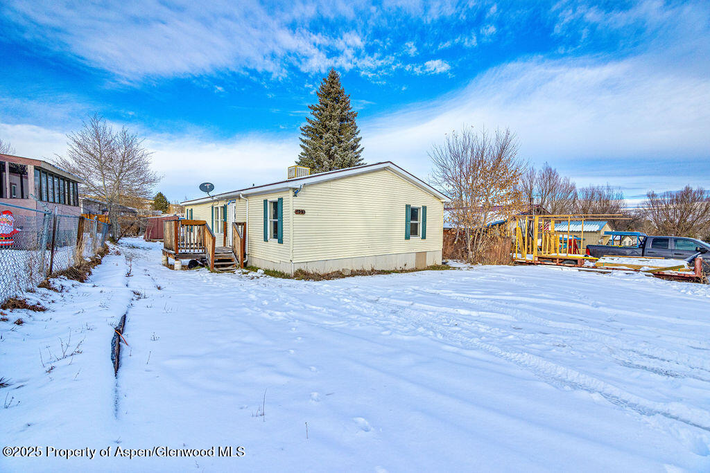 405 Hawthorn Street Craig, CO 81625 - Photo 2 of 35 a view of a house with a yard
