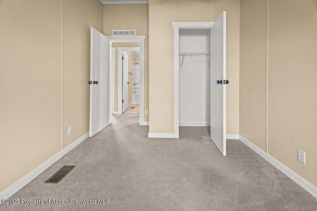 405 Hawthorn Street Craig, CO 81625 - Photo 21 of 35 a view of an empty room and closet