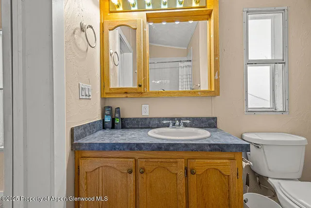 a bathroom with a sink toilet and tub