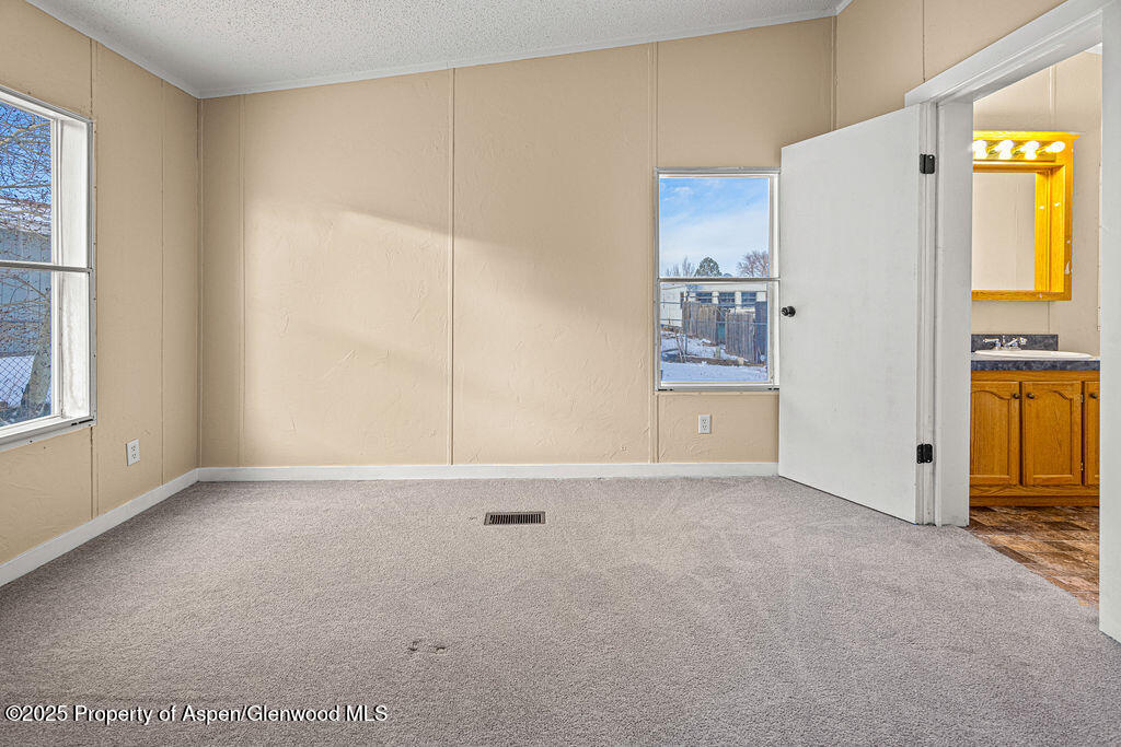 405 Hawthorn Street Craig, CO 81625 - Photo 29 of 35 a view of an empty room with a window