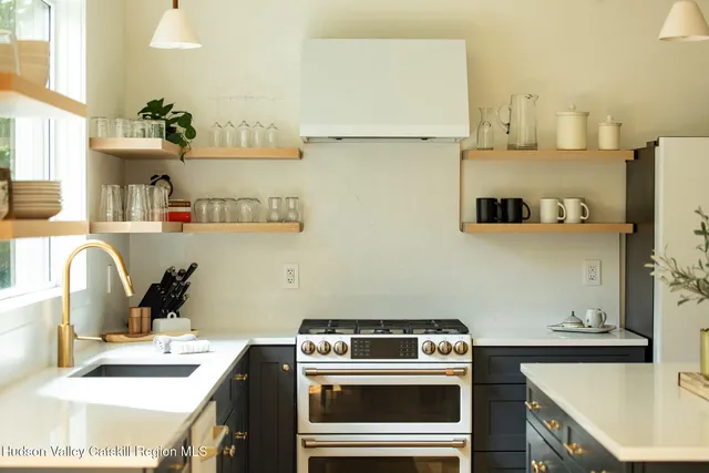 a kitchen with a stove and a refrigerator