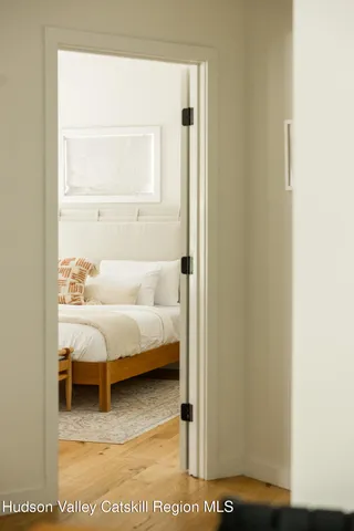 a living room with a bed furniture and a window
