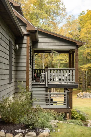a swimming pool with outdoor seating and yard