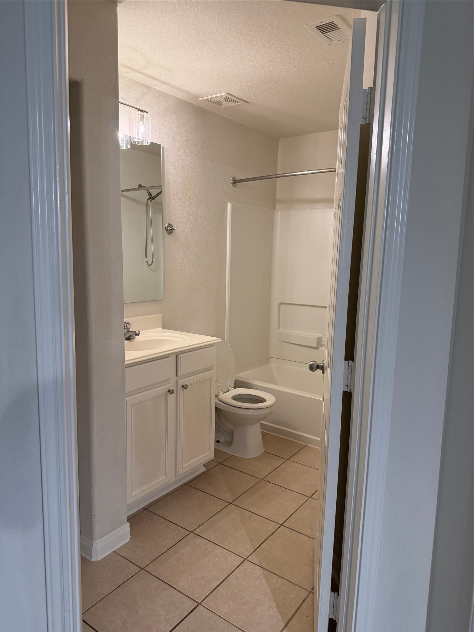 9919 Opal Rock Drive Rosharon, TX 77583 - Photo 11 of 21 a bathroom with a granite countertop sink toilet and shower