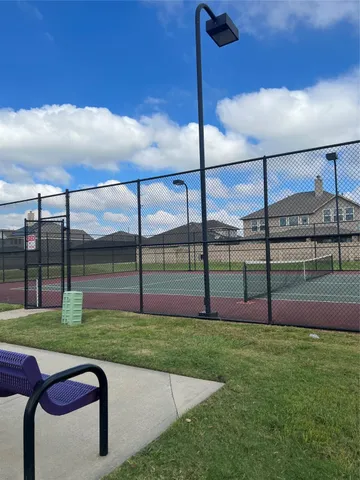 a view of pool with tree s