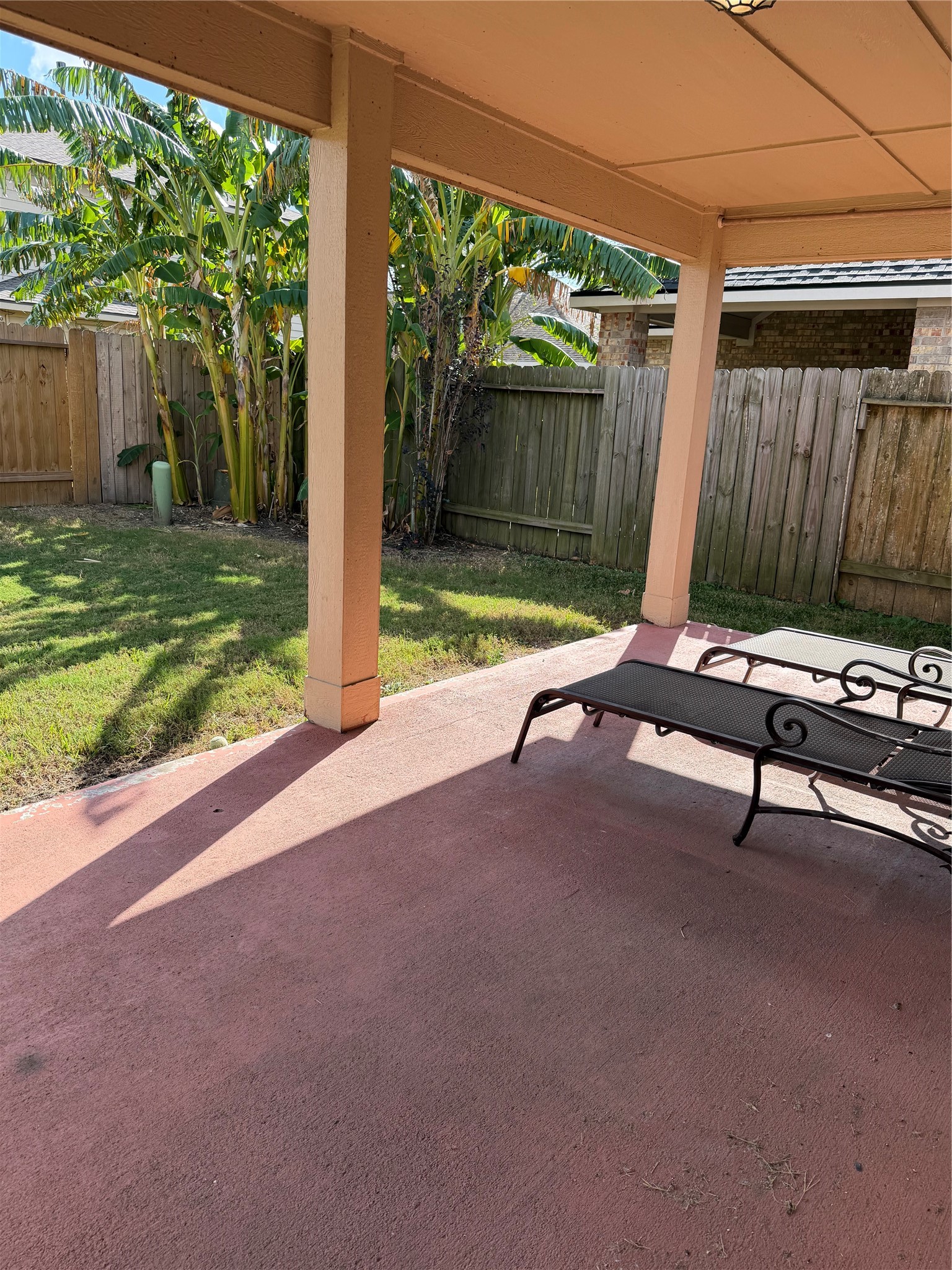 9919 Opal Rock Drive Rosharon, TX 77583 - Photo 5 of 21 a view of a two chair in the back yard of a house