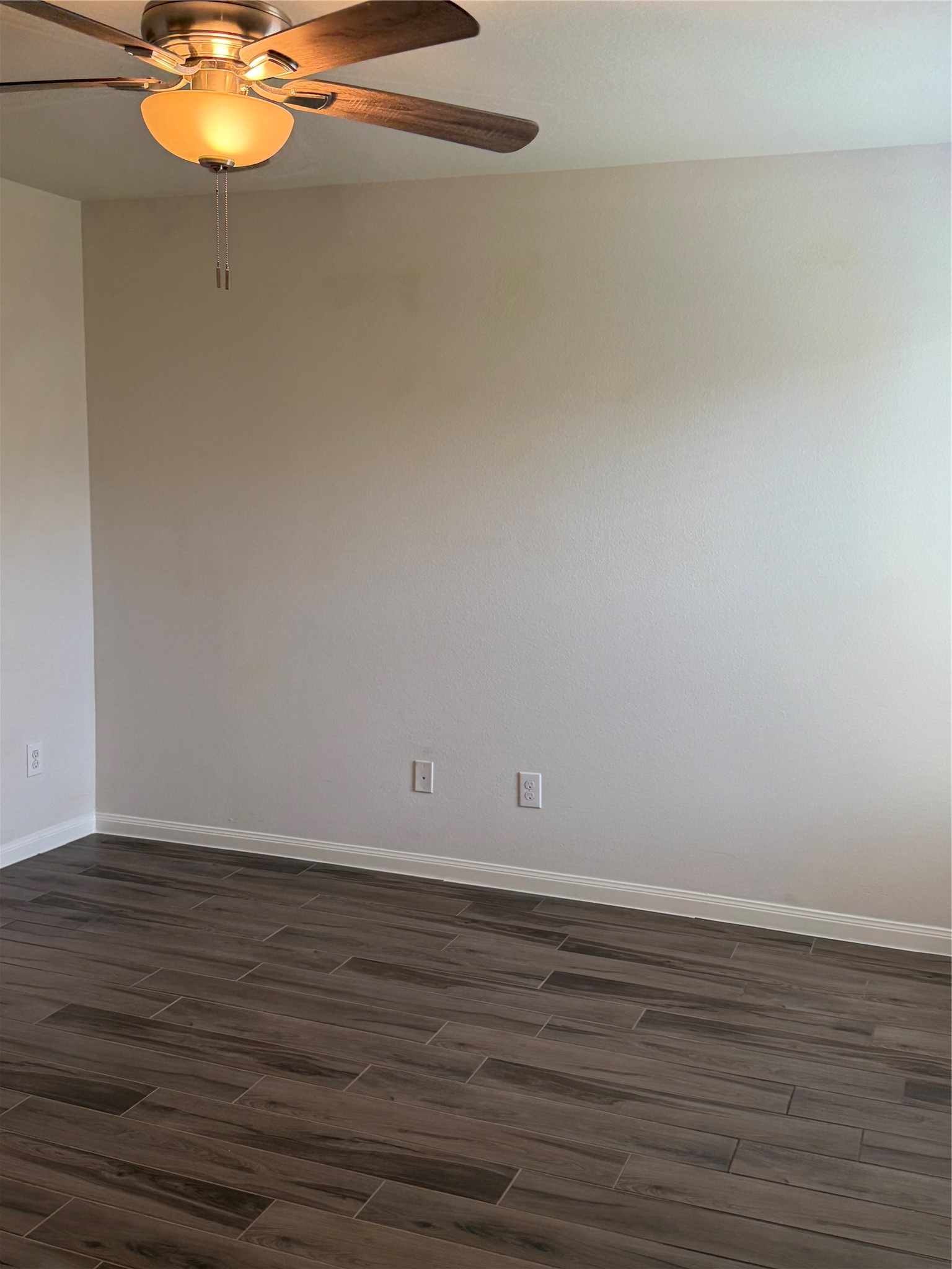 9919 Opal Rock Drive Rosharon, TX 77583 - Photo 8 of 21 a view of an empty room with wooden floor