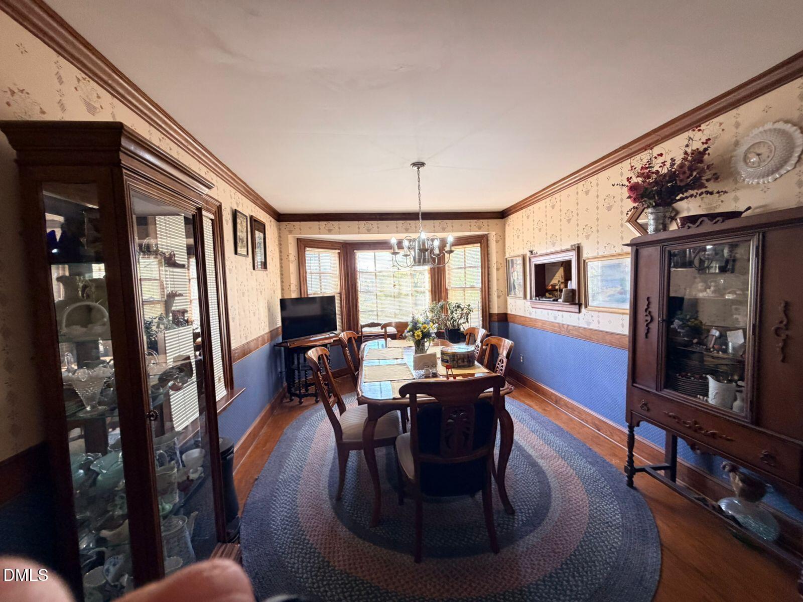 9222 Midway Road Bailey, NC 27807 - Photo 11 of 35 a living room with fireplace furniture and a wooden floor