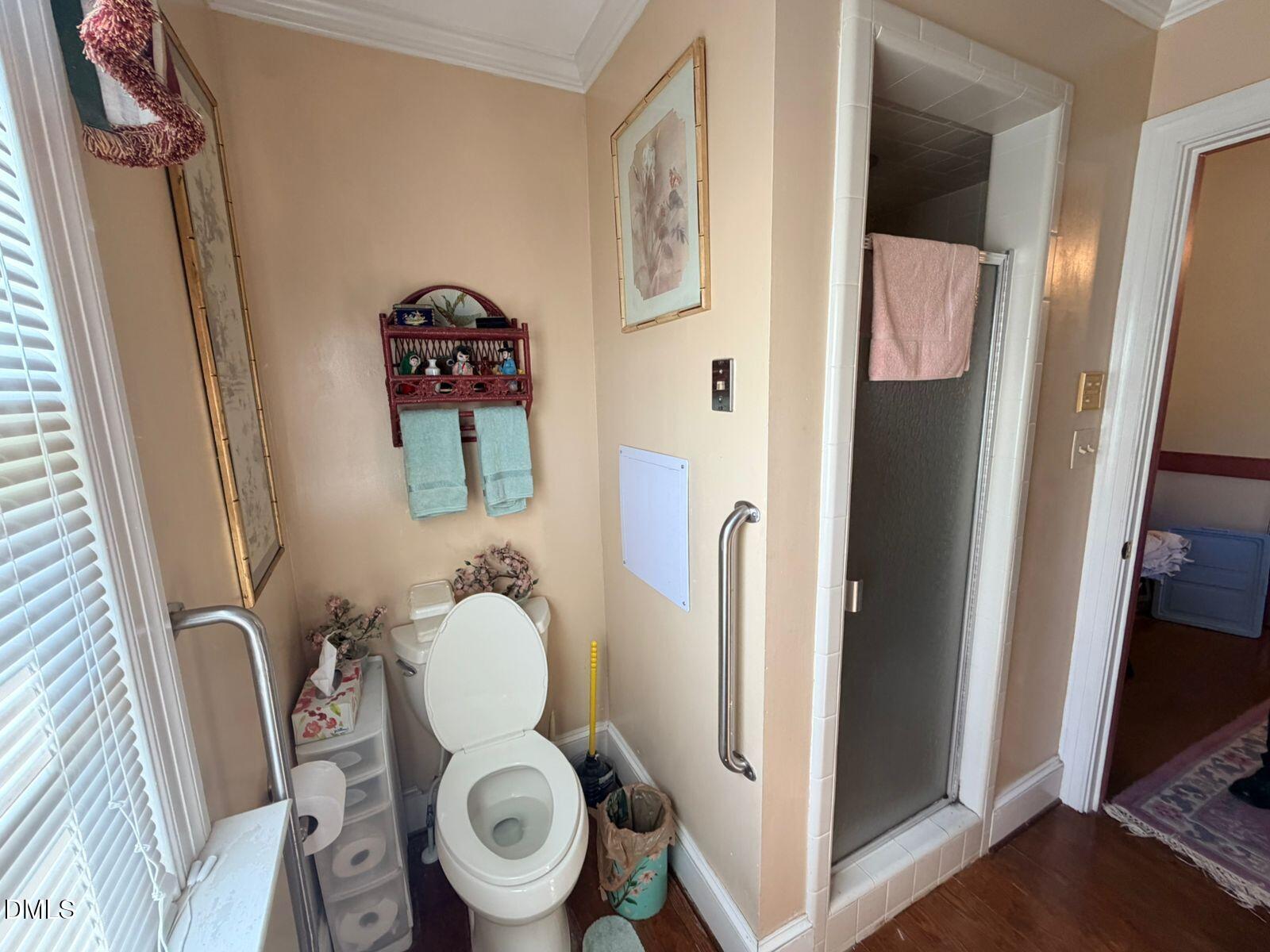 9222 Midway Road Bailey, NC 27807 - Photo 17 of 35 a bathroom with a toilet and a mirror
