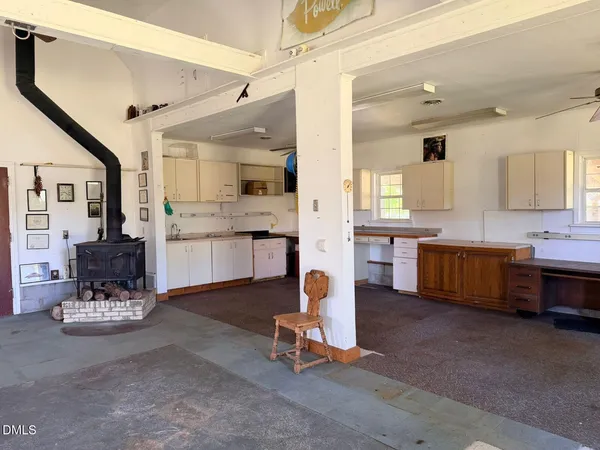 a living room with kitchen furniture and kitchen view