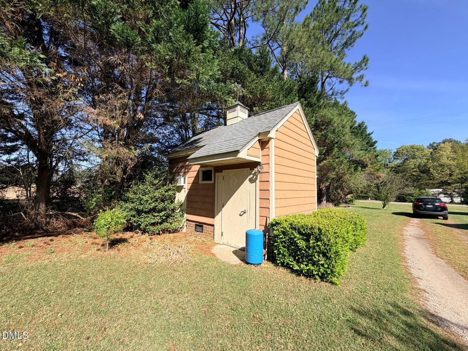 9222 Midway Road Bailey, NC 27807 - Photo 33 of 35 a view of a house with a yard and tree