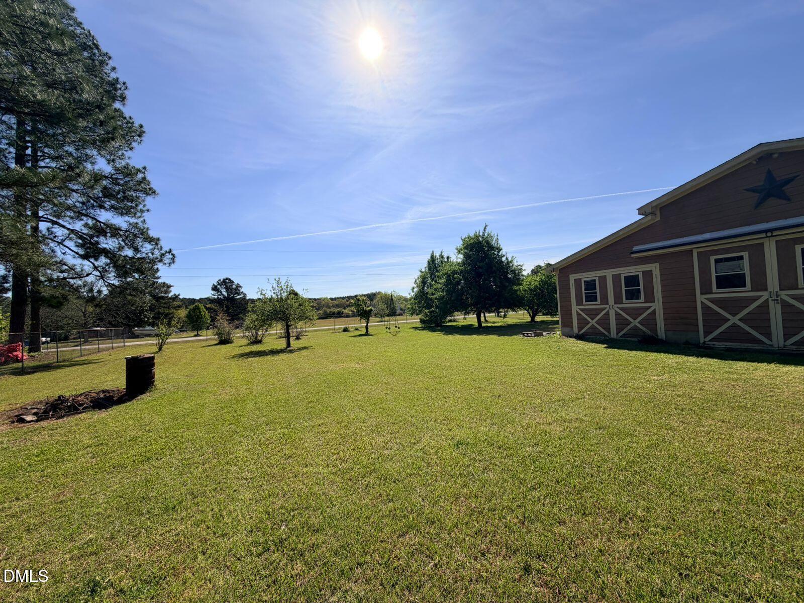 9222 Midway Road Bailey, NC 27807 - Photo 35 of 35 a view of a house with yard and trampoline