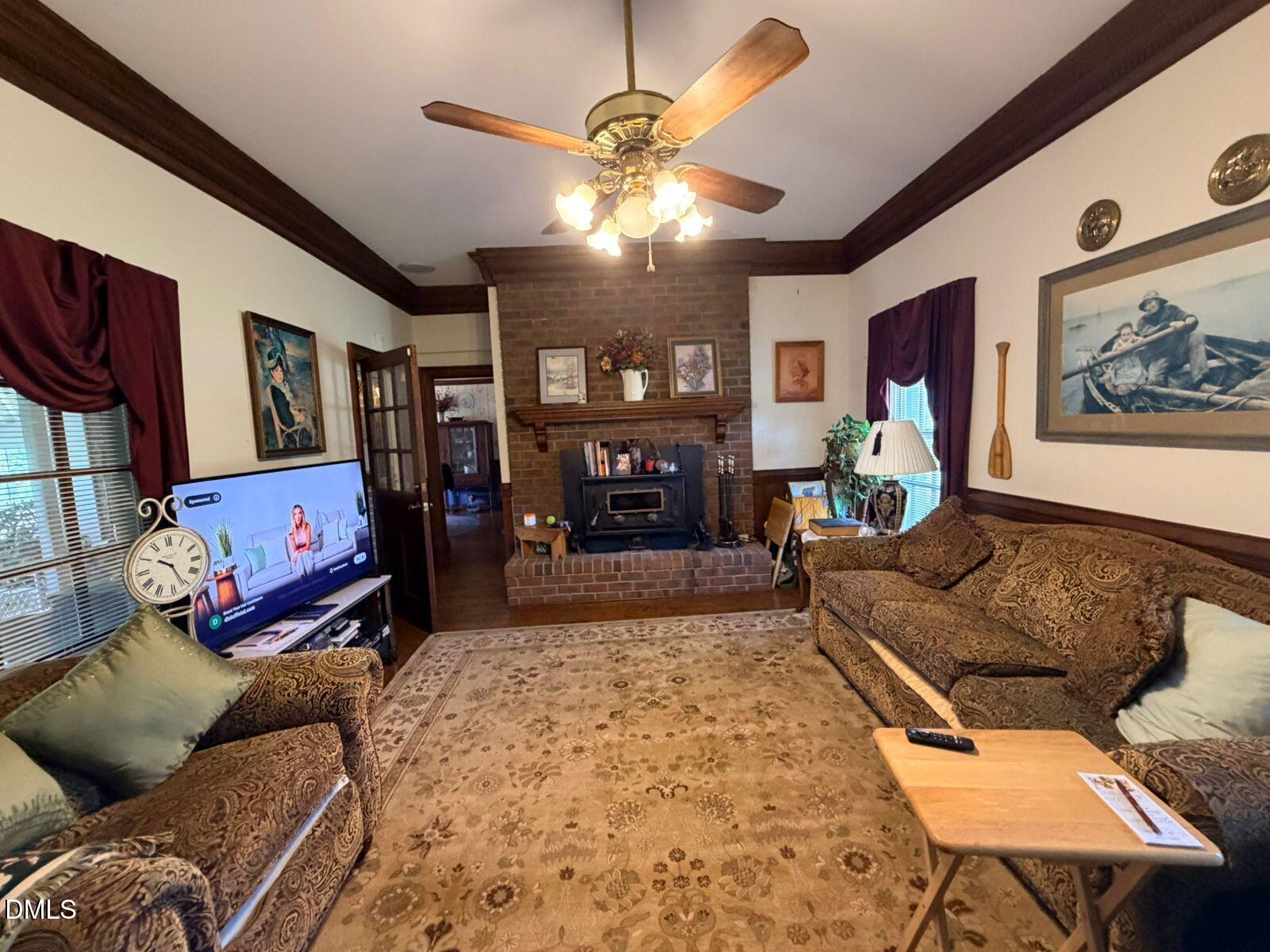 9222 Midway Road Bailey, NC 27807 - Photo 4 of 35 a living room with furniture and a fireplace