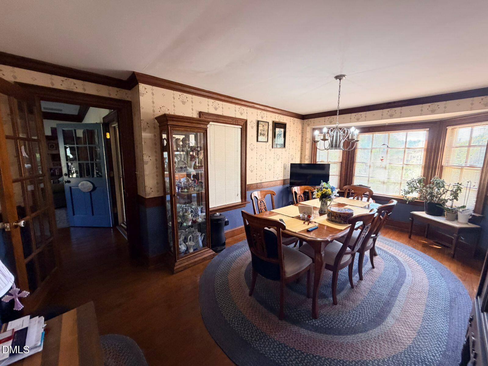 9222 Midway Road Bailey, NC 27807 - Photo 8 of 35 a view of a dining room with furniture window and wooden floor