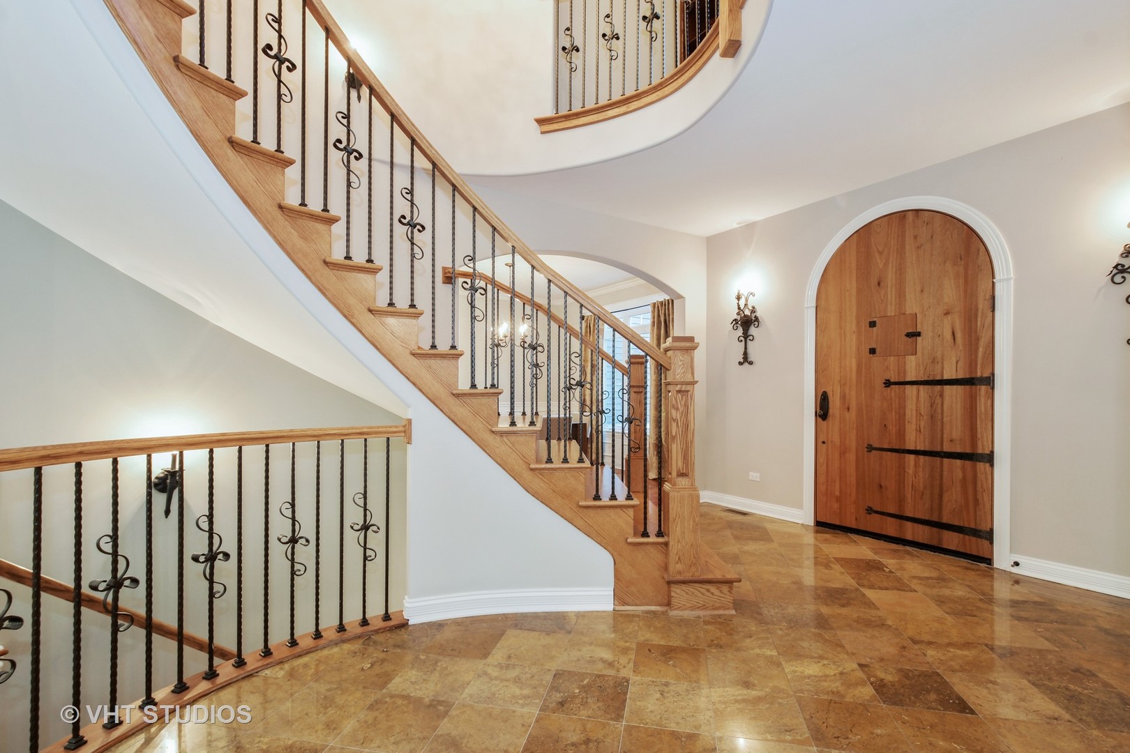 1021 Linden Lane Glenview, IL 60025 - Photo 2 of 26 a view of staircase with lots of frames on wall and wooden floor