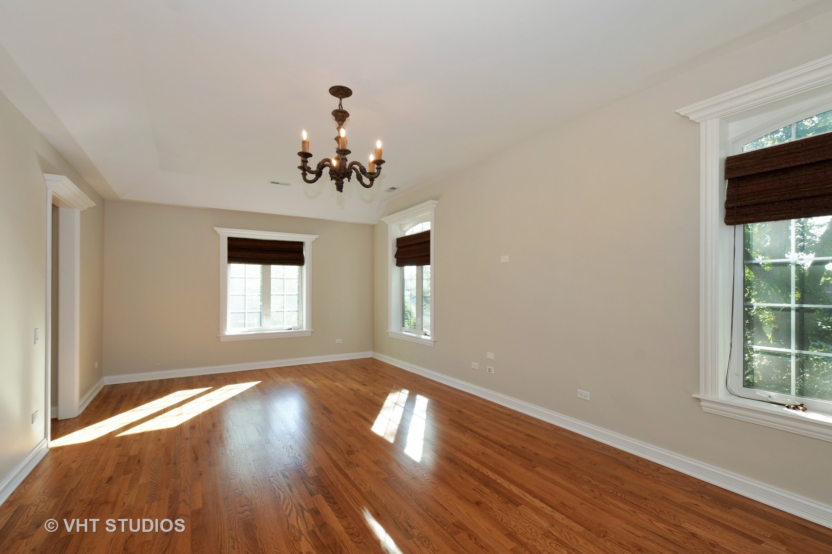 1021 Linden Lane Glenview, IL 60025 - Photo 12 of 26 an empty room with wooden floor and windows