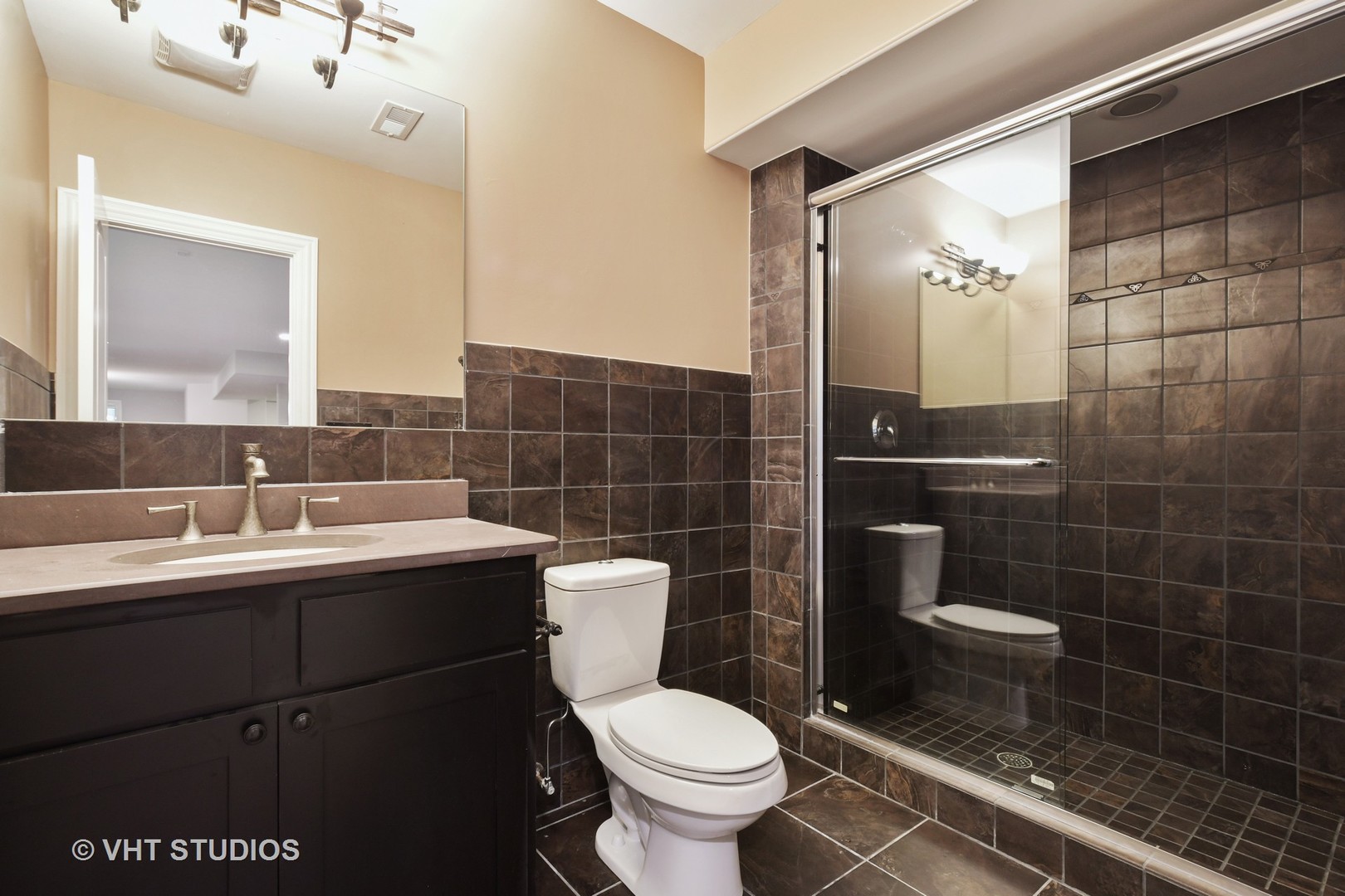 1021 Linden Lane Glenview, IL 60025 - Photo 19 of 26 a bathroom with a toilet a sink and mirror