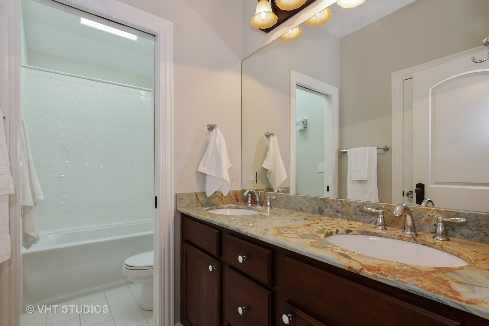 1021 Linden Lane Glenview, IL 60025 - Photo 21 of 26 a bathroom with a granite countertop sink toilet and shower