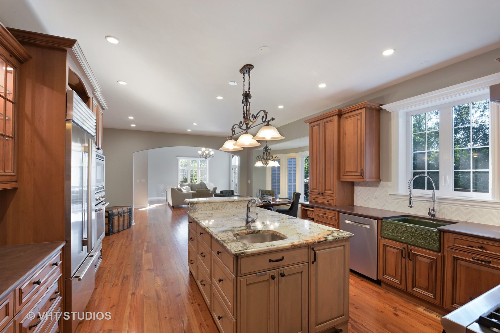 1021 Linden Lane Glenview, IL 60025 - Photo 5 of 26 a kitchen with granite countertop a sink stove and wooden floor