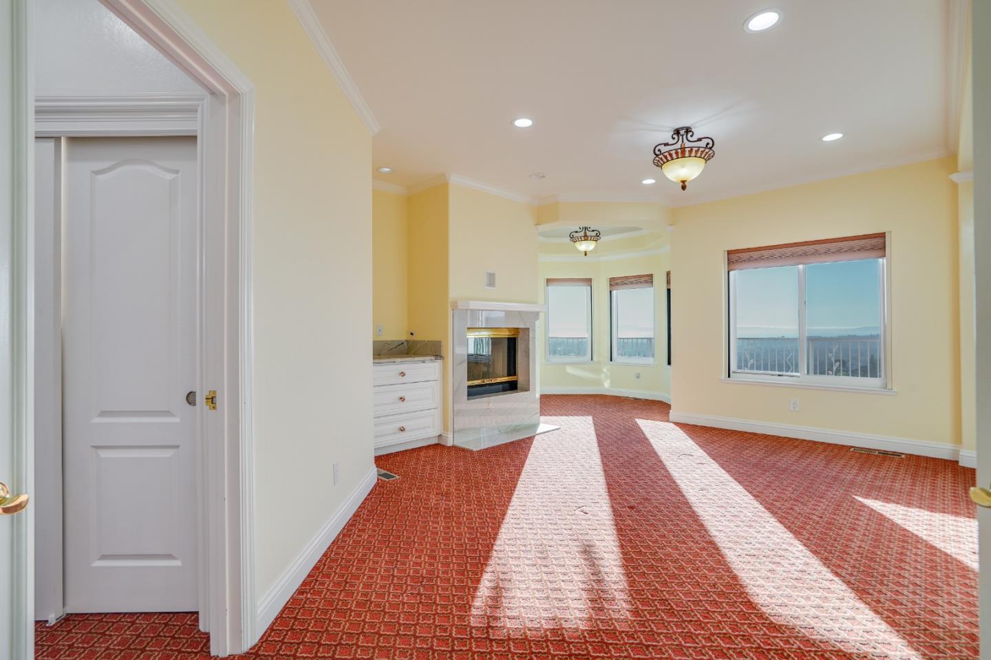 20460 Viewpoint Road Castro Valley, CA 94552 - Photo 21 of 50 a view of a bedroom with wooden floor and a ceiling fan