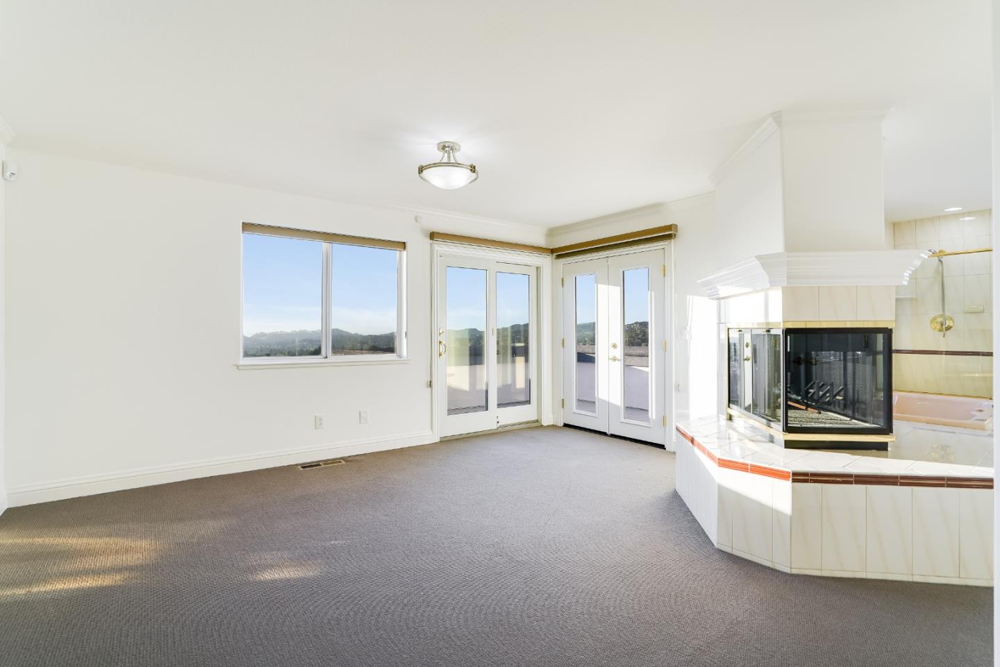 20460 Viewpoint Road Castro Valley, CA 94552 - Photo 28 of 50 a view of an empty room with a fireplace
