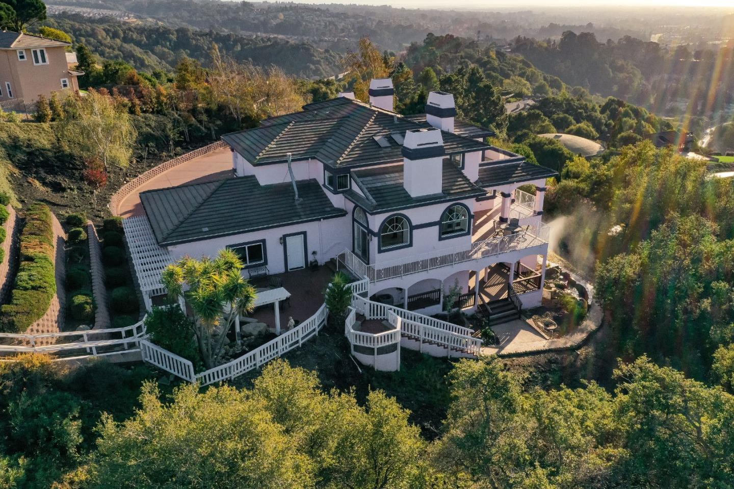 20460 Viewpoint Road Castro Valley, CA 94552 - Photo 3 of 50 an aerial view of a house with a garden and lake view