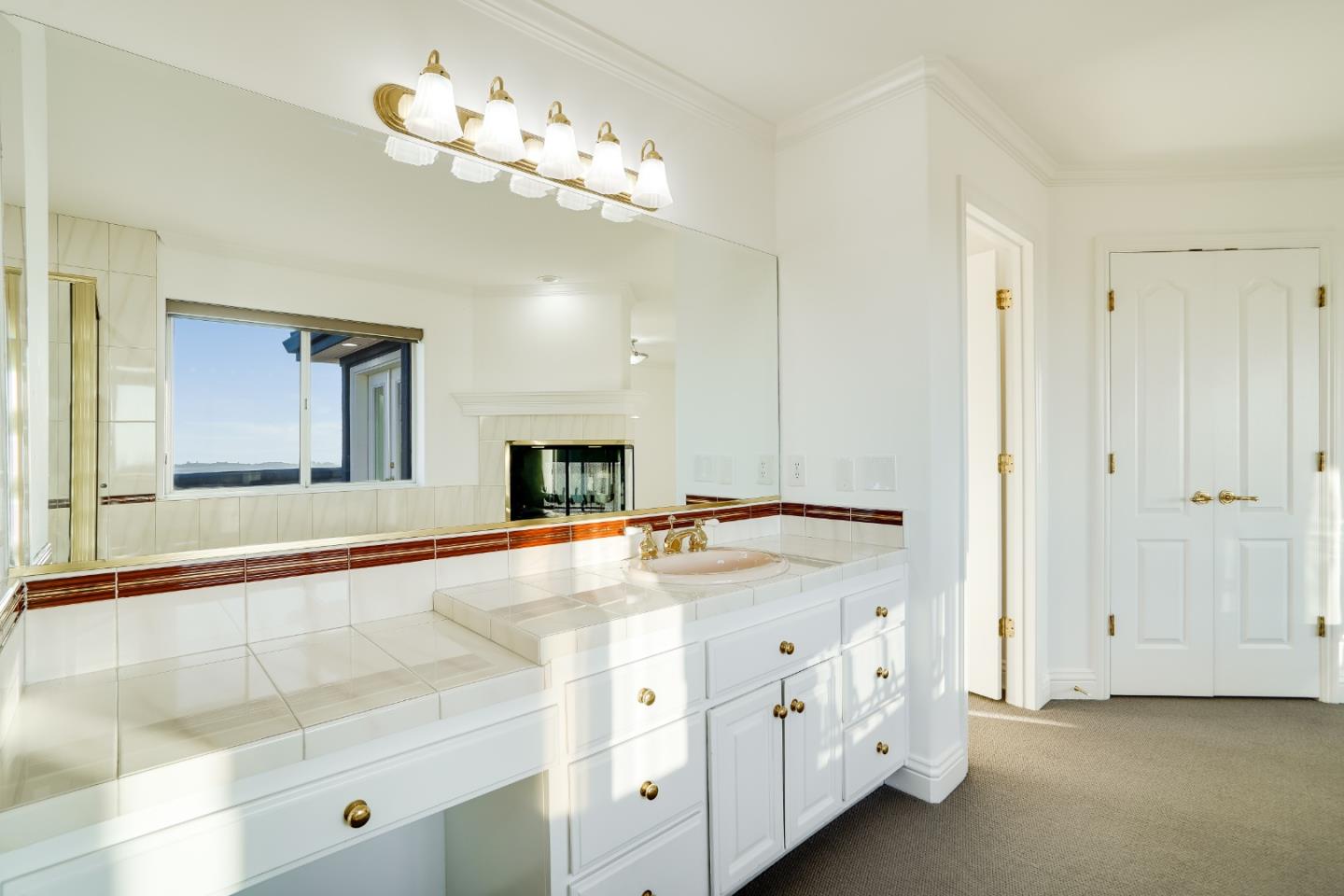 20460 Viewpoint Road Castro Valley, CA 94552 - Photo 31 of 50 a spacious bathroom with a double vanity sink and a mirror