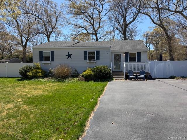 10 Hollingsworth Place Centereach, NY 11720 - Photo 1 of 19 a front view of a house with a garden