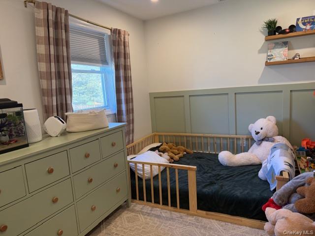 10 Hollingsworth Place Centereach, NY 11720 - Photo 13 of 19 a room with baby crib furniture and window