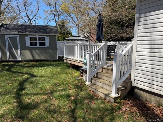 10 Hollingsworth Place Centereach, NY 11720 - Photo 18 of 19 a view of a house with a yard