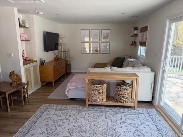 10 Hollingsworth Place Centereach, NY 11720 - Photo 4 of 19 a utility room with furniture a flat screen tv and a window