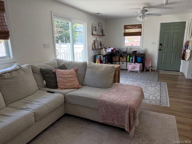 10 Hollingsworth Place Centereach, NY 11720 - Photo 6 of 19 a living room with furniture and a window
