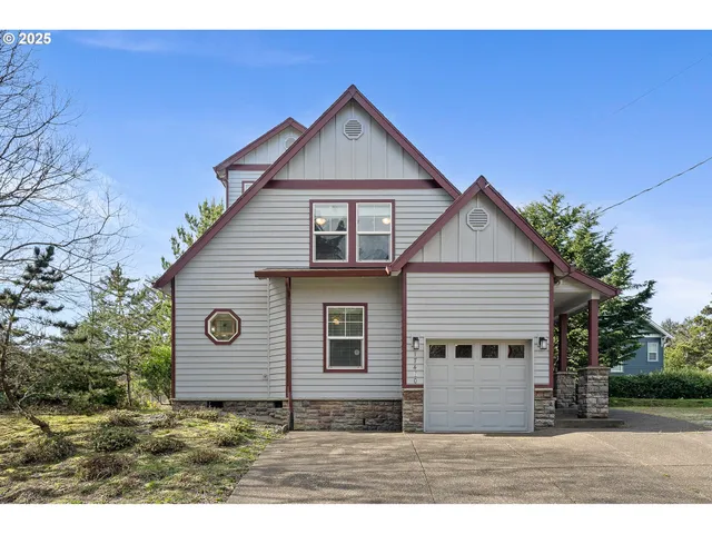 a front view of a house with a garden