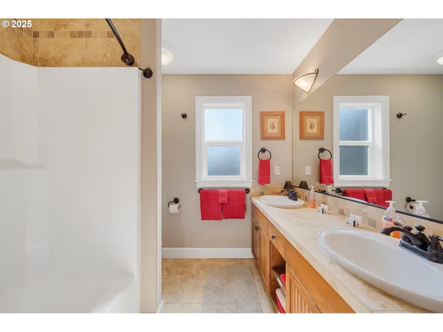 a balcony with furniture and wooden floor