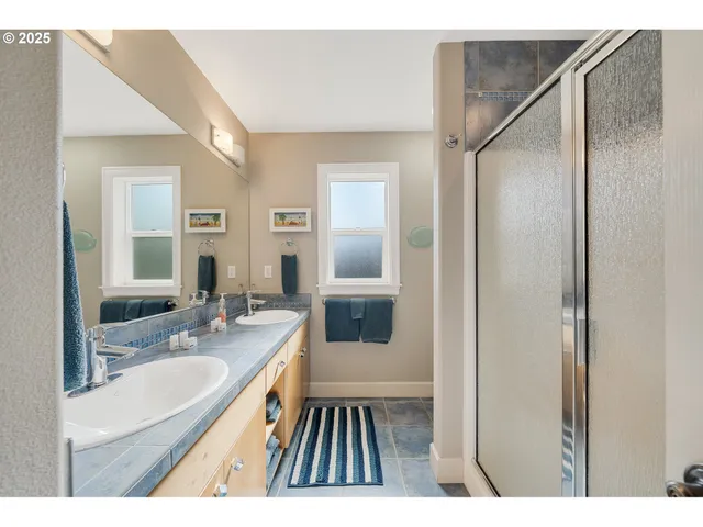 a bedroom with a bed and a large mirror