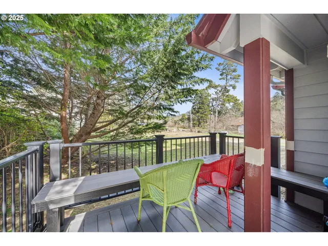 a balcony with furniture and wooden floor