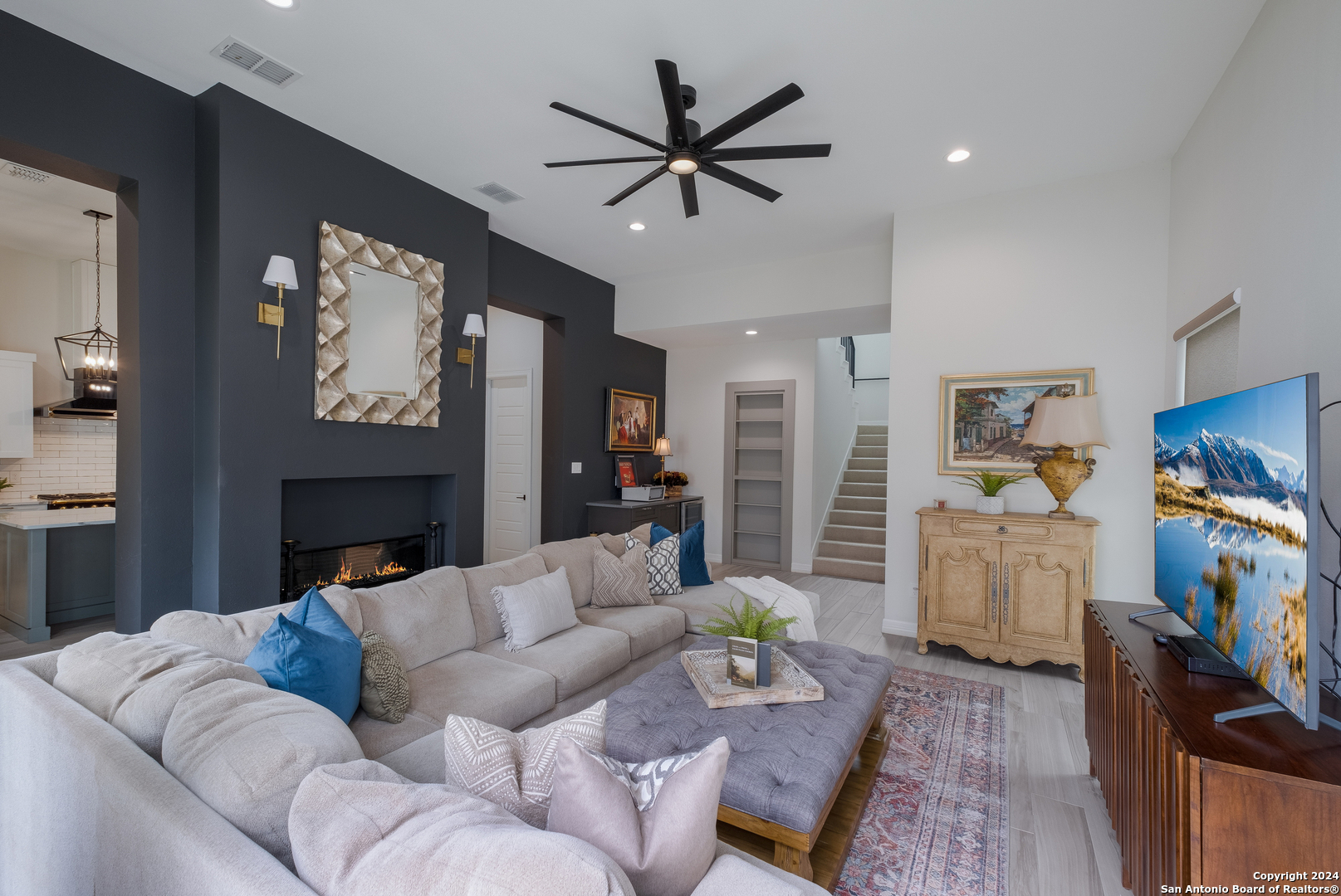 718 Post Oak Ridge Way Bulverde, TX 78163 - Photo 11 of 60 a living room with furniture and a flat screen tv