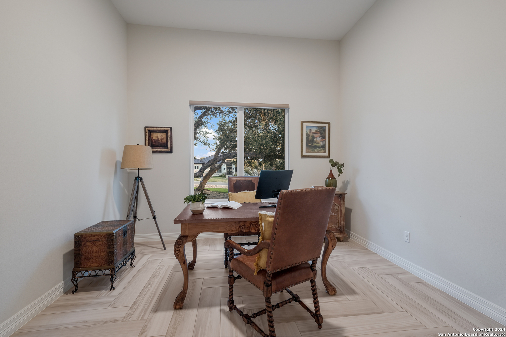 718 Post Oak Ridge Way Bulverde, TX 78163 - Photo 19 of 60 a view of a workspace with furniture and a window