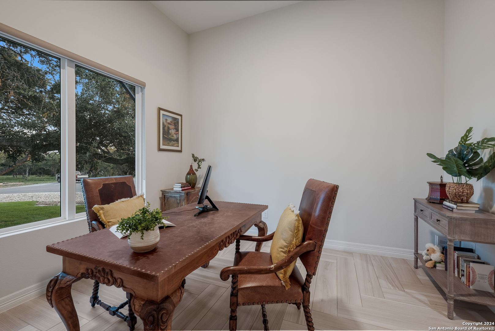 718 Post Oak Ridge Way Bulverde, TX 78163 - Photo 20 of 60 a view of a dining room with furniture window and wooden floor