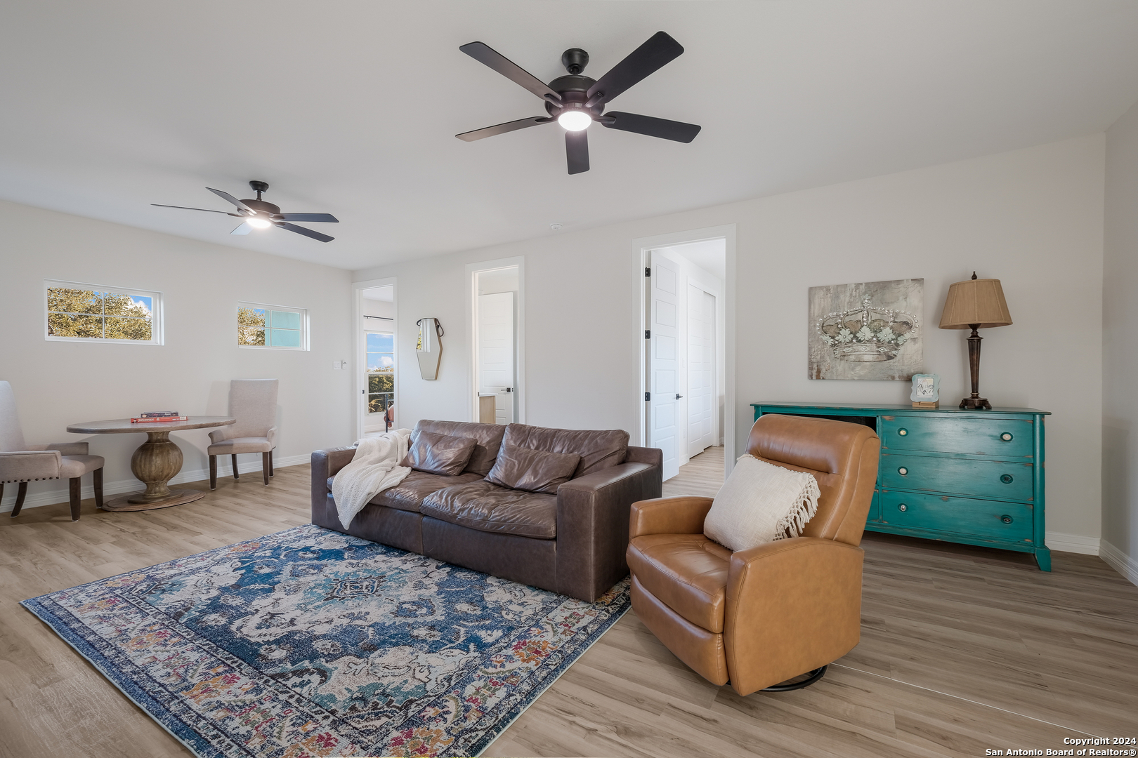 718 Post Oak Ridge Way Bulverde, TX 78163 - Photo 29 of 60 a living room with furniture and a rug