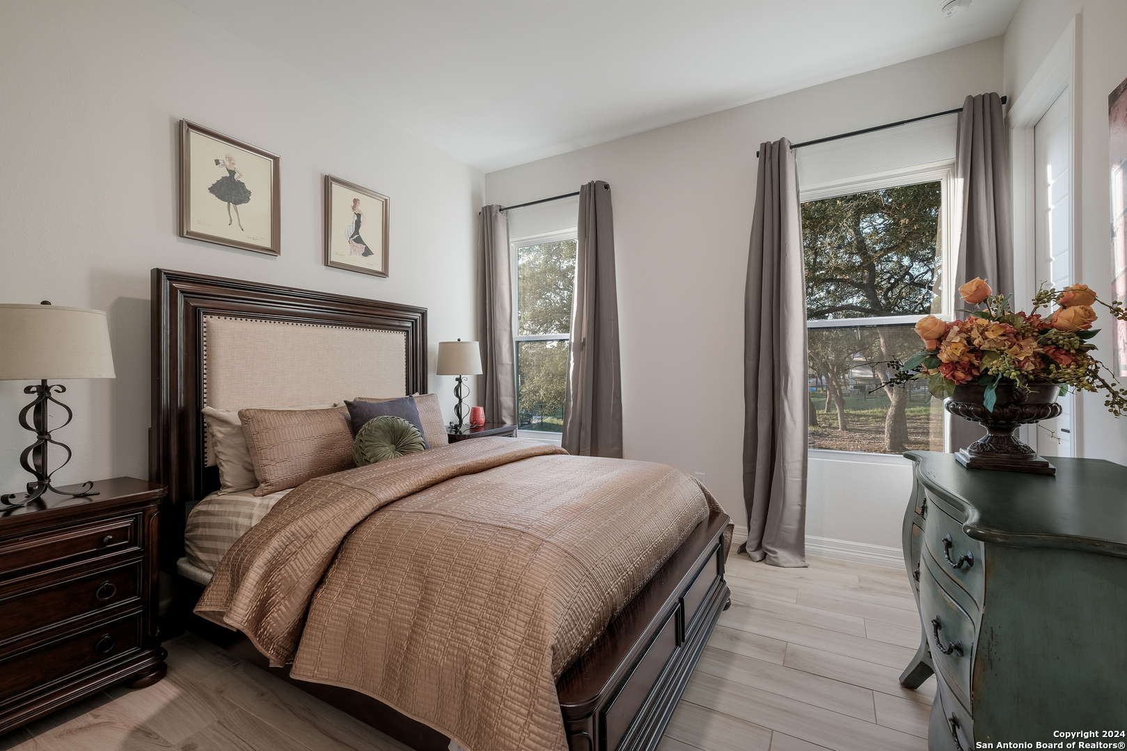 718 Post Oak Ridge Way Bulverde, TX 78163 - Photo 30 of 60 a bedroom with a bed potted plant and a window