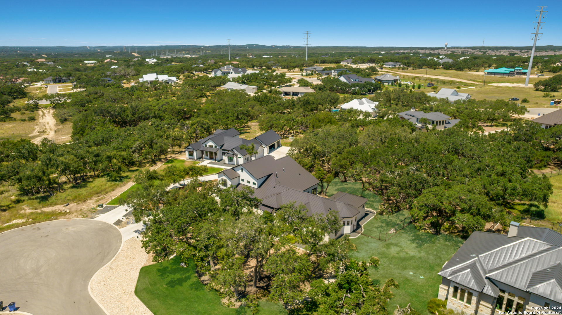 718 Post Oak Ridge Way Bulverde, TX 78163 - Photo 41 of 60 an aerial view of residential houses with outdoor space and trees