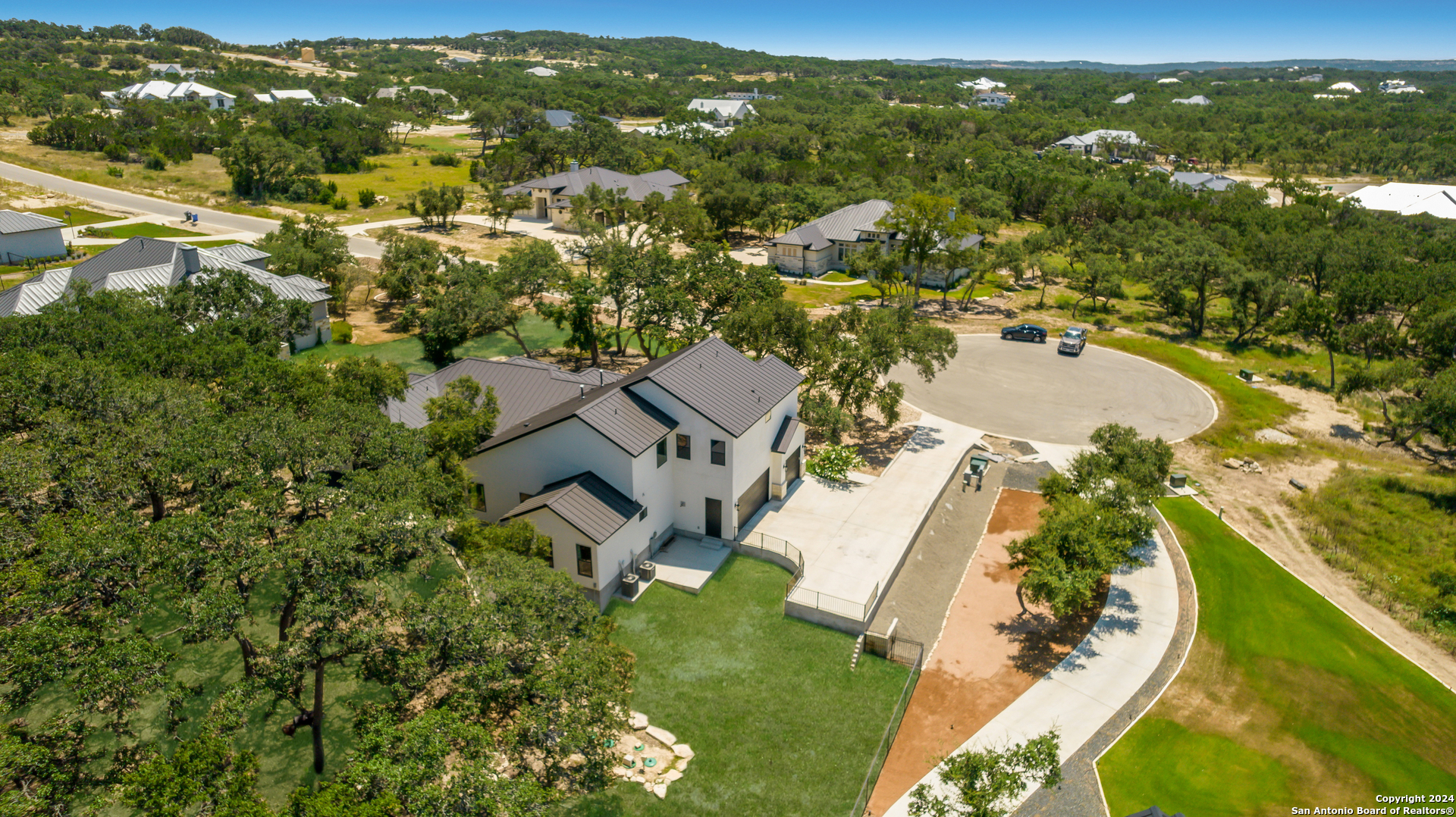 718 Post Oak Ridge Way Bulverde, TX 78163 - Photo 44 of 60 an aerial view of residential houses with outdoor space and river