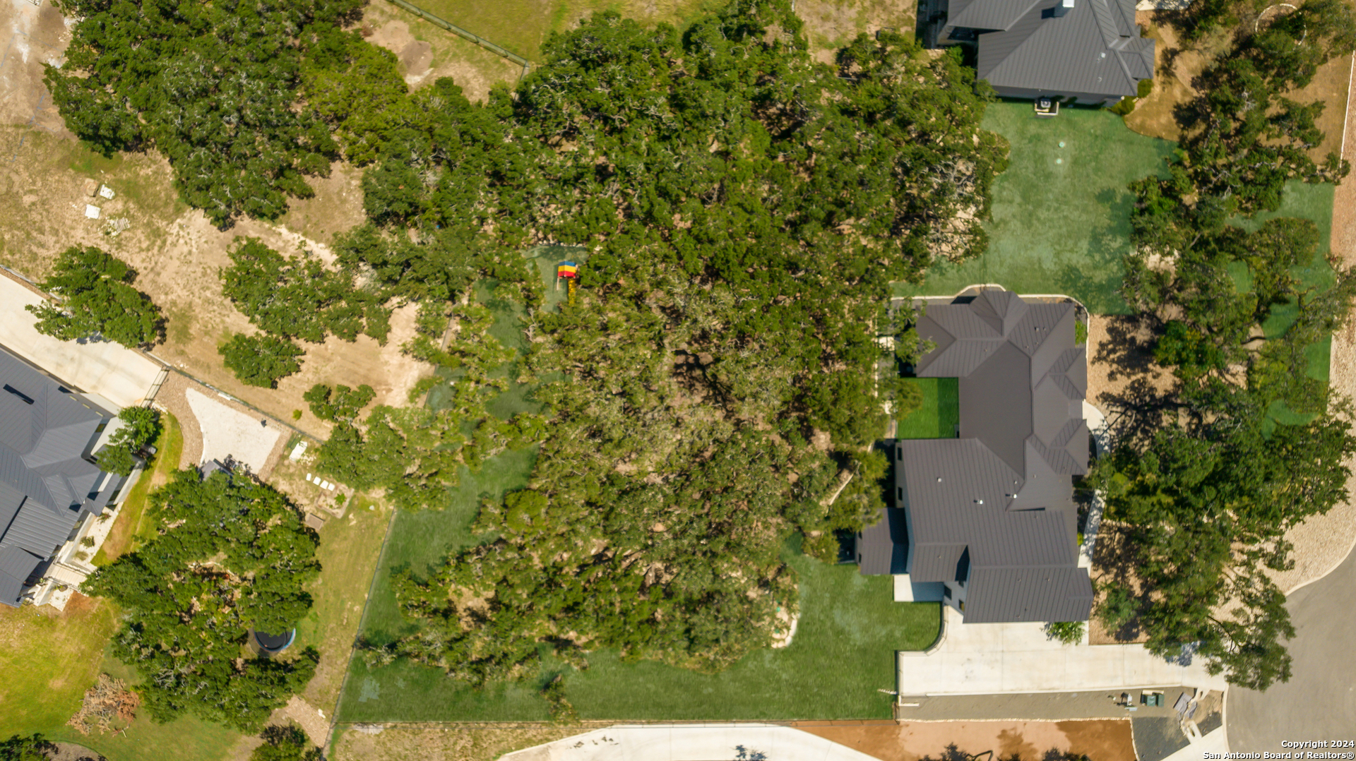 718 Post Oak Ridge Way Bulverde, TX 78163 - Photo 48 of 60 an aerial view of a house with a yard and garden